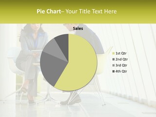 A Man And Woman Sitting At A Table With A Laptop PowerPoint Template