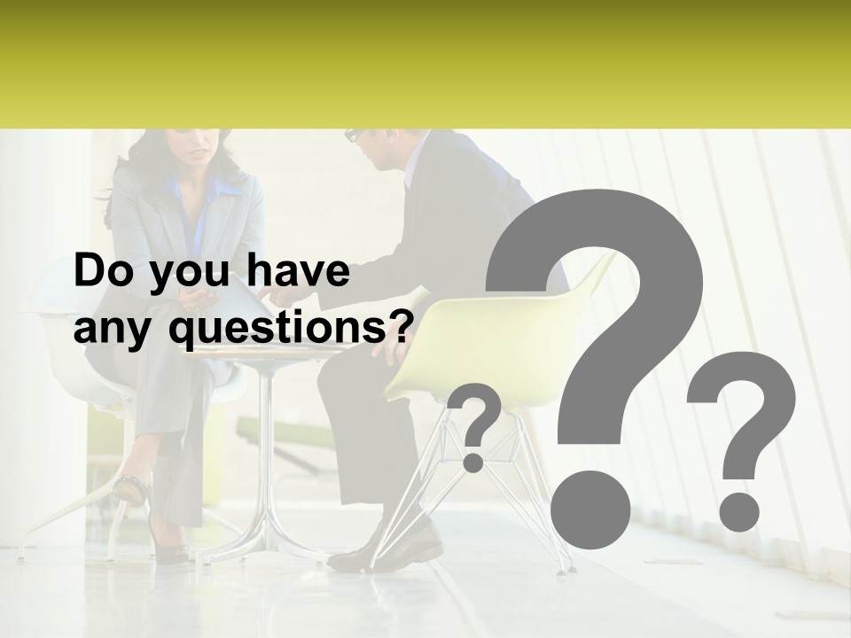 A Man And Woman Sitting At A Table With A Laptop PowerPoint Template