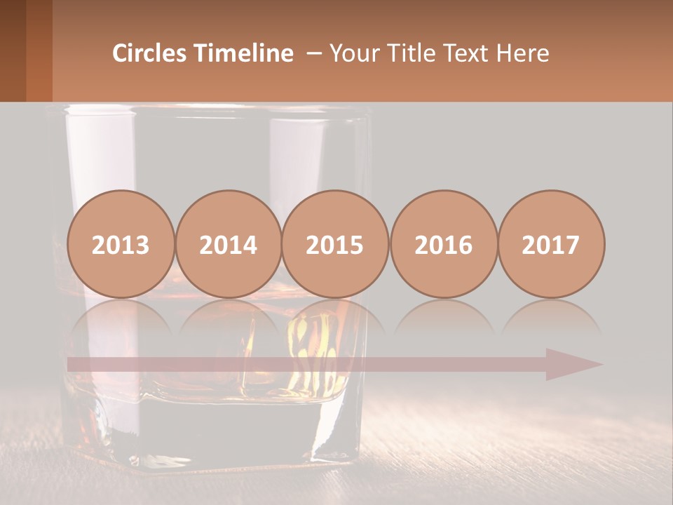 A Glass Of Whiskey On A Wooden Table PowerPoint Template