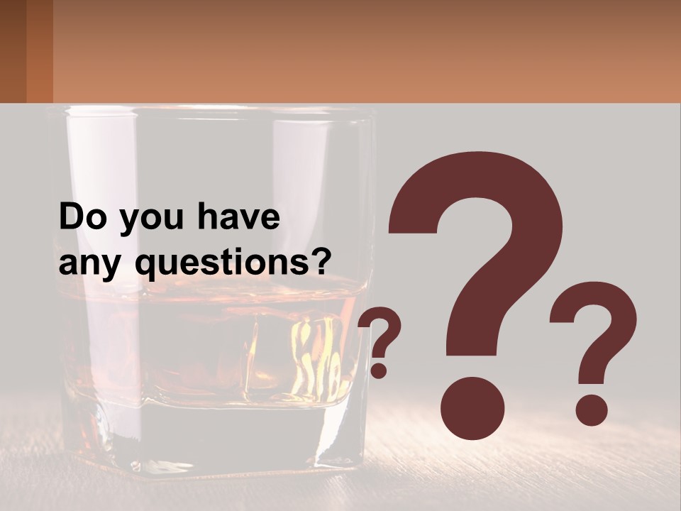 A Glass Of Whiskey On A Wooden Table PowerPoint Template