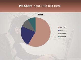 A Man Sitting At A Desk With A Laptop In Front Of His Head PowerPoint Template