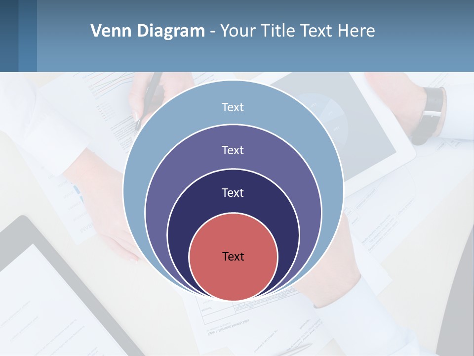 A Group Of People Sitting At A Table With A Tablet PowerPoint Template