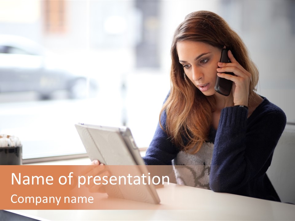 A Woman Sitting At A Table Talking On A Cell Phone PowerPoint Template