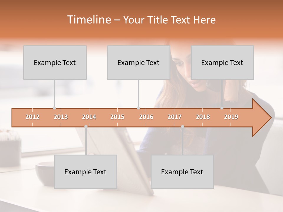 A Woman Sitting At A Table Talking On A Cell Phone PowerPoint Template
