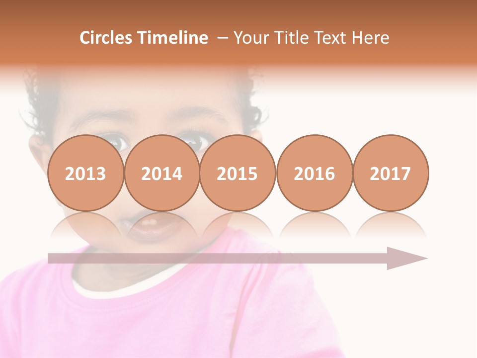 A Baby Girl In A Pink Shirt Is Looking At The Camera PowerPoint Template