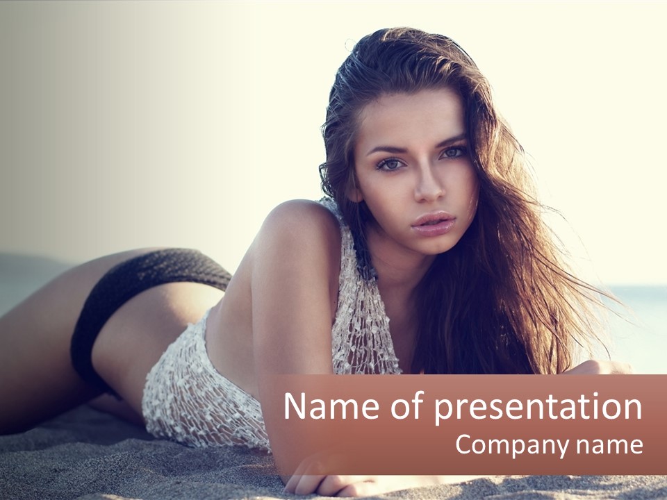 A Woman In A Bikini Laying On The Beach PowerPoint Template