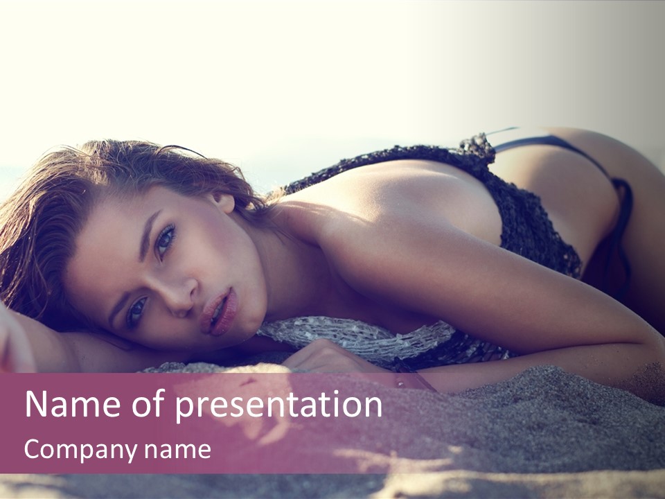 A Woman In A Bikini Laying On The Beach PowerPoint Template