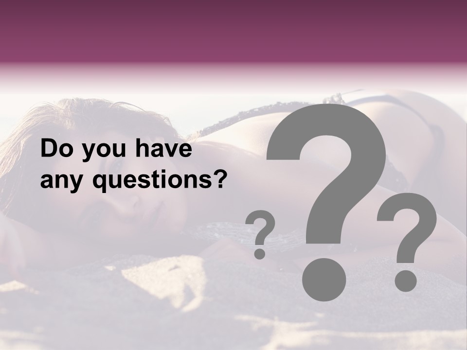 A Woman In A Bikini Laying On The Beach PowerPoint Template