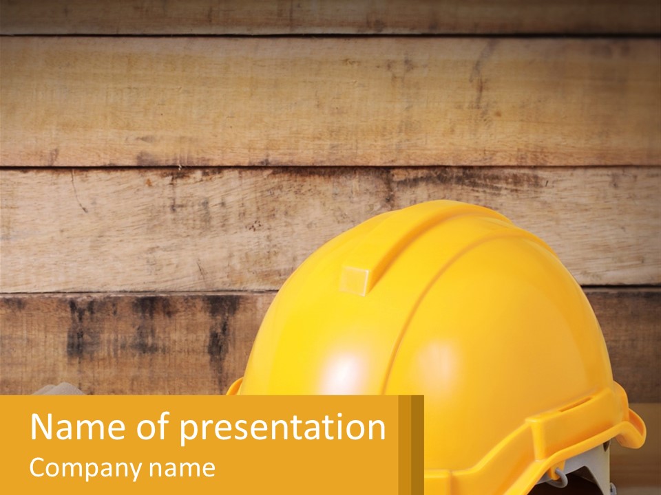 A Yellow Hard Hat Sitting On Top Of A Wooden Table PowerPoint Template
