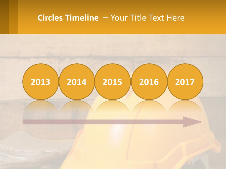 A Yellow Hard Hat Sitting On Top Of A Wooden Table PowerPoint Template