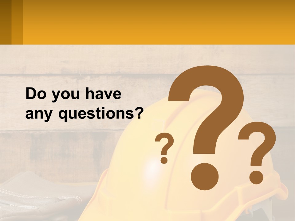 A Yellow Hard Hat Sitting On Top Of A Wooden Table PowerPoint Template