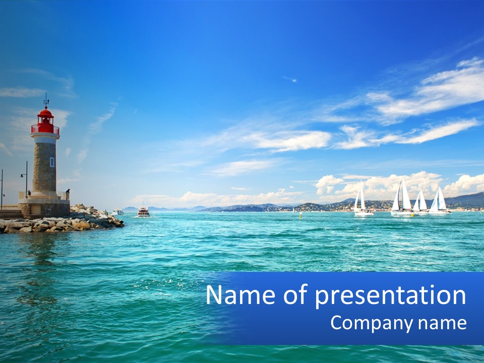 A Lighthouse With Sailboats In The Water On A Sunny Day PowerPoint Template