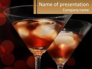 A Couple Of Glasses Filled With Liquid On Top Of A Table PowerPoint Template
