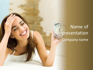 A Woman Laying On A Bed Holding An Alarm Clock PowerPoint Template