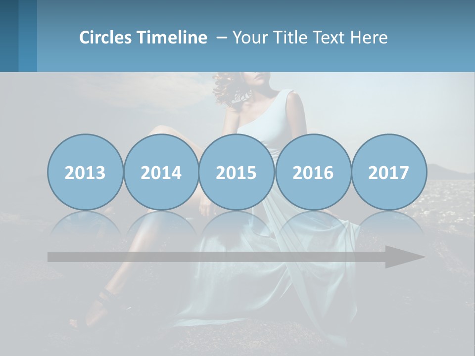 A Woman In A Blue Dress Is Sitting On A Rock PowerPoint Template