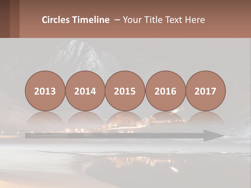 A Snowy Mountain With A Town Lit Up At Night PowerPoint Template