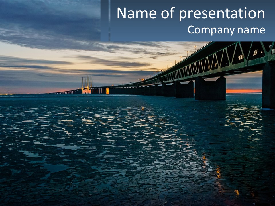 A Bridge Over A Body Of Water At Sunset PowerPoint Template
