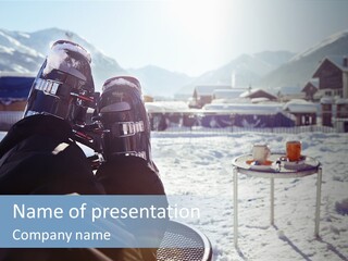 A Couple Of People That Are Sitting In The Snow PowerPoint Template
