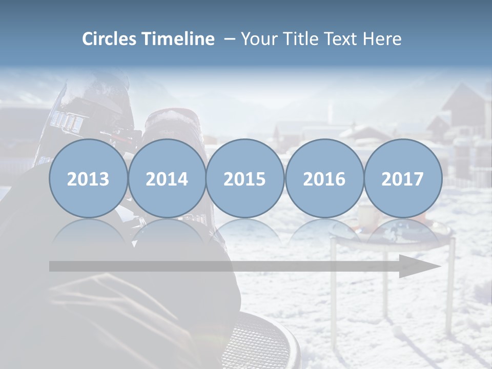 A Couple Of People That Are Sitting In The Snow PowerPoint Template