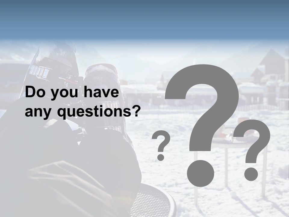 A Couple Of People That Are Sitting In The Snow PowerPoint Template