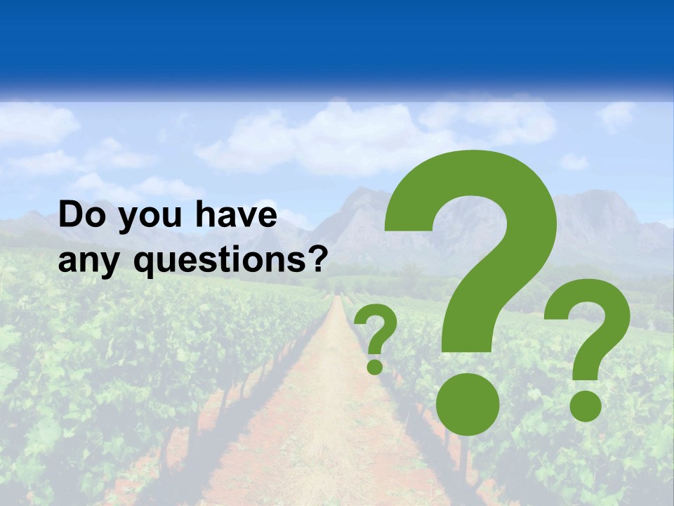 A Vineyard Field With Mountains In The Background PowerPoint Template