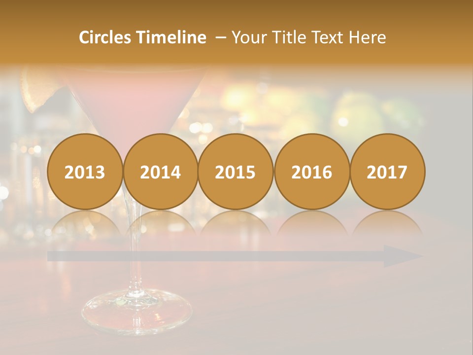 A Red Cocktail Sitting On Top Of A Wooden Table PowerPoint Template