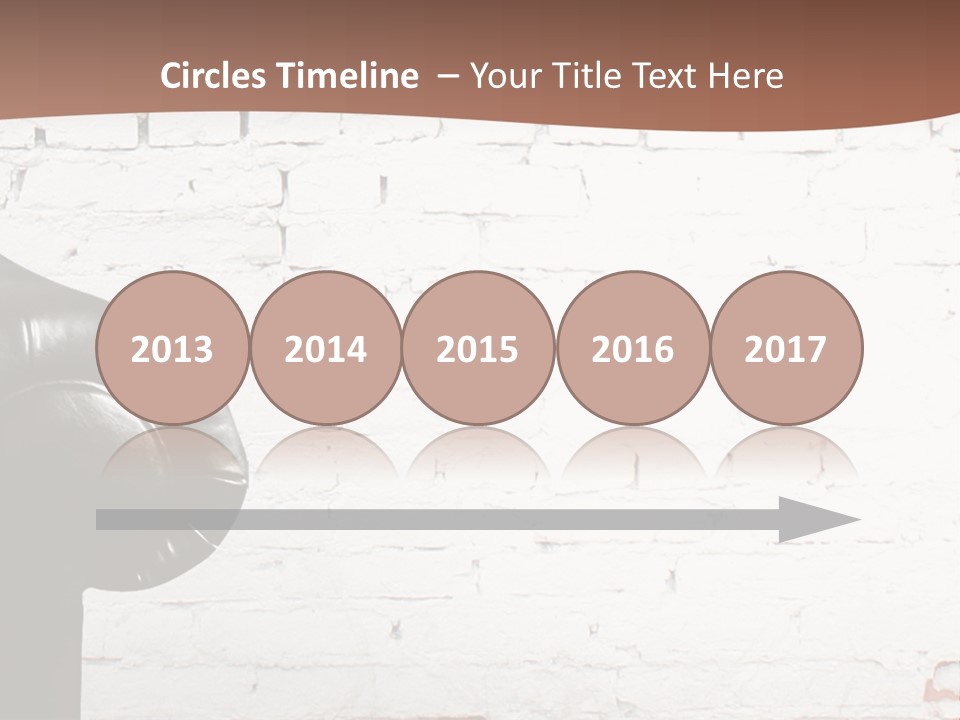 A Black Leather Chair Sitting In Front Of A Brick Wall PowerPoint Template