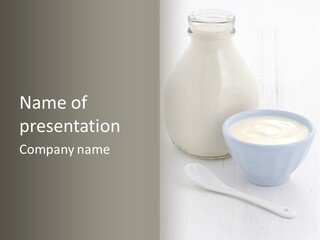 A Bowl Of Yogurt Next To A Bottle Of Milk PowerPoint Template