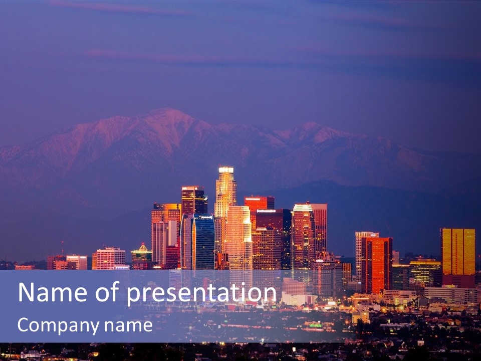 A City Skyline With Mountains In The Background PowerPoint Template