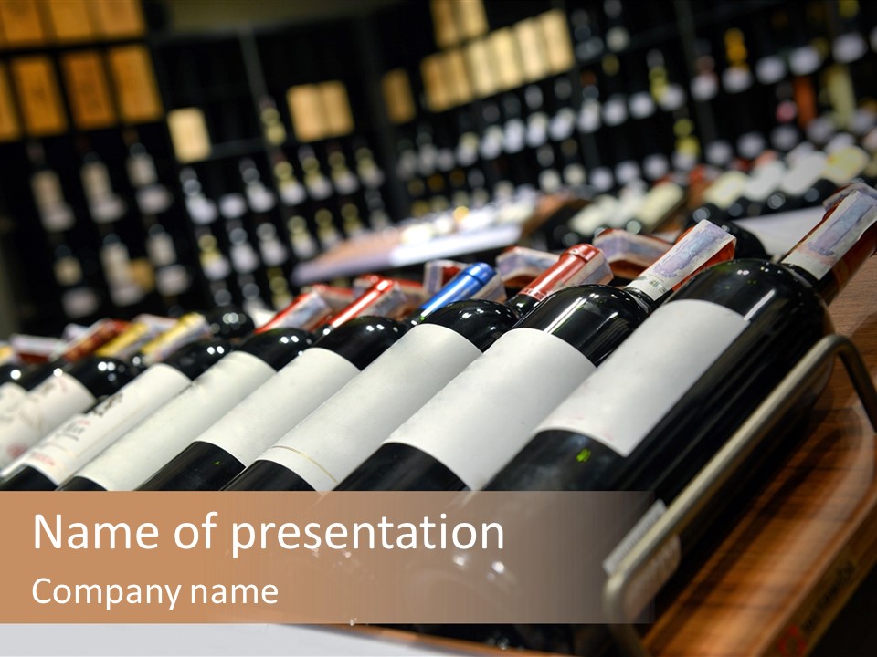 A Row Of Wine Bottles Sitting On Top Of A Wooden Table PowerPoint Template