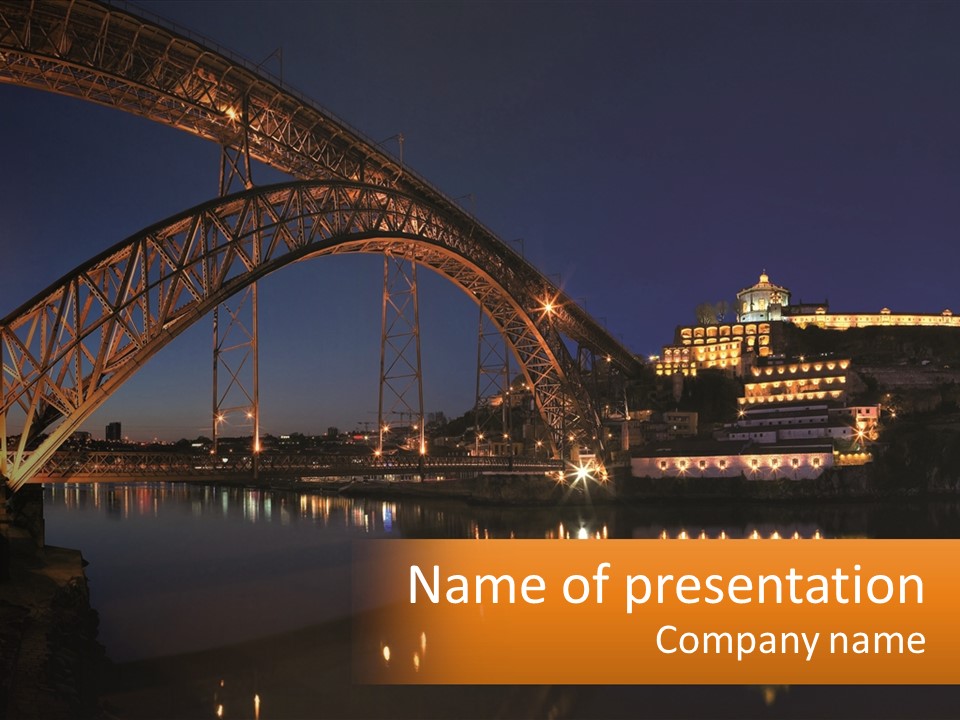 A Bridge Over A Body Of Water At Night PowerPoint Template