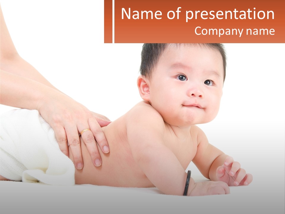 A Baby Laying On Its Back With A Person Holding It PowerPoint Template