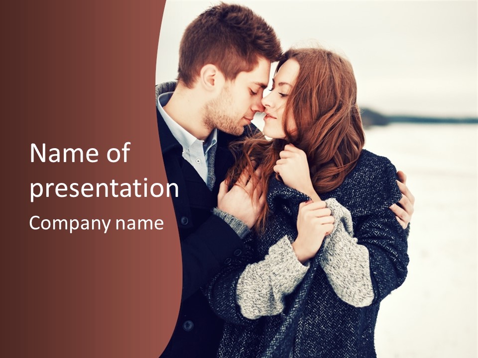 A Man And A Woman Kissing In Front Of A Brown Background PowerPoint Template