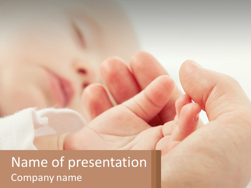 A Person Holding A Baby In Their Hands PowerPoint Template