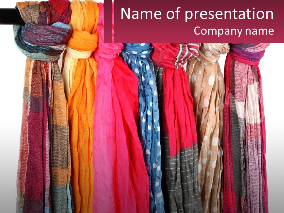A Bunch Of Scarves Hanging On A Rack PowerPoint Template