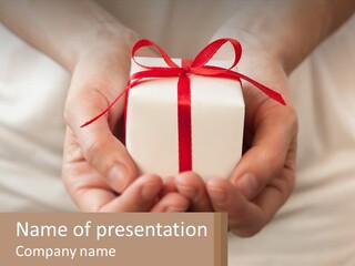 A Person Holding A Present In Their Hands PowerPoint Template