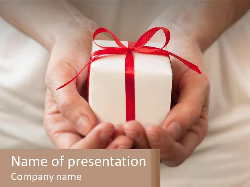 A Person Holding A Present In Their Hands PowerPoint Template