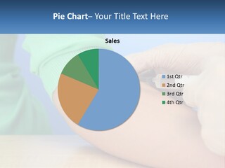 A Person In A Green Shirt Is Holding A Sys PowerPoint Template