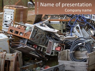 A Pile Of Old Electrical Equipment In A Yard PowerPoint Template