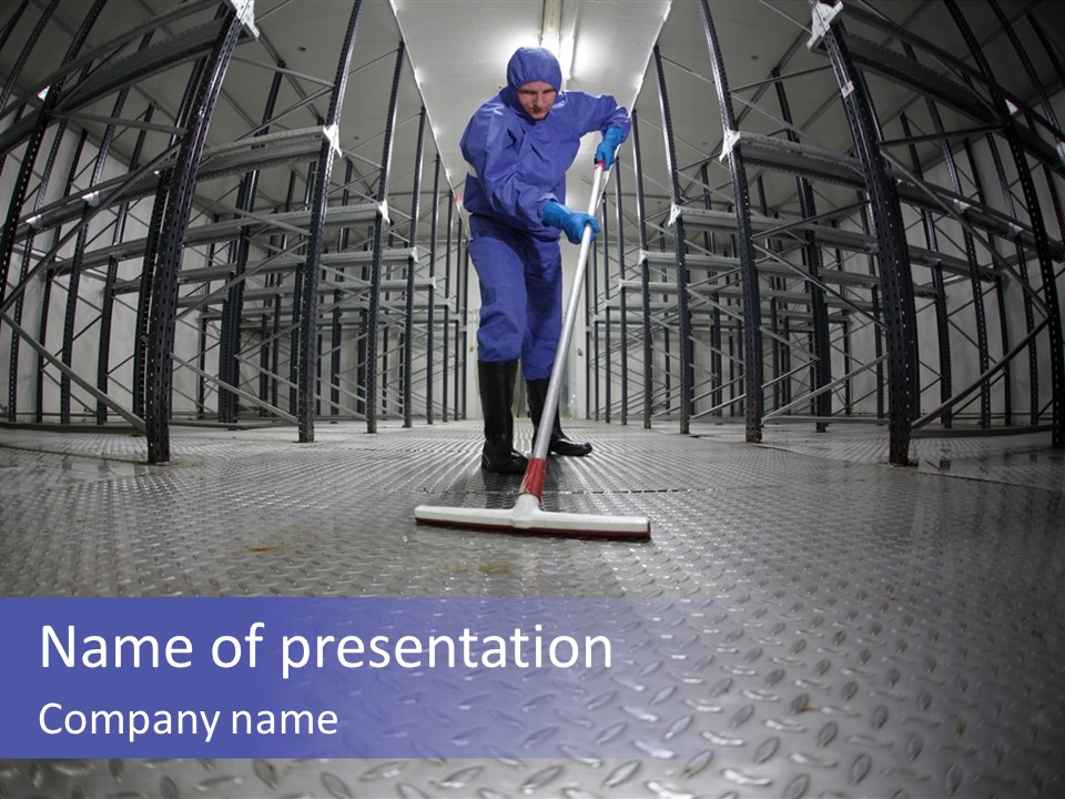 A Man In A Blue Coverall Is Cleaning The Floor With A Mop PowerPoint Template