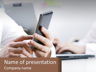 A Person Using A Cell Phone In Front Of A Laptop PowerPoint Template