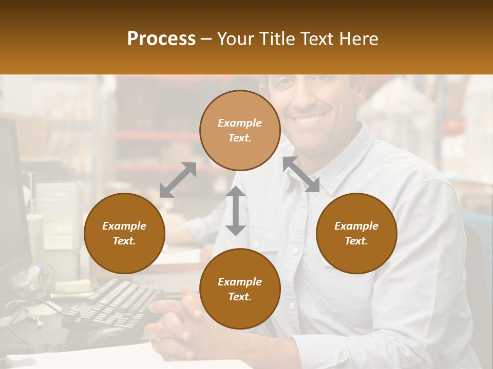A Man Sitting At A Desk In Front Of A Computer PowerPoint Template