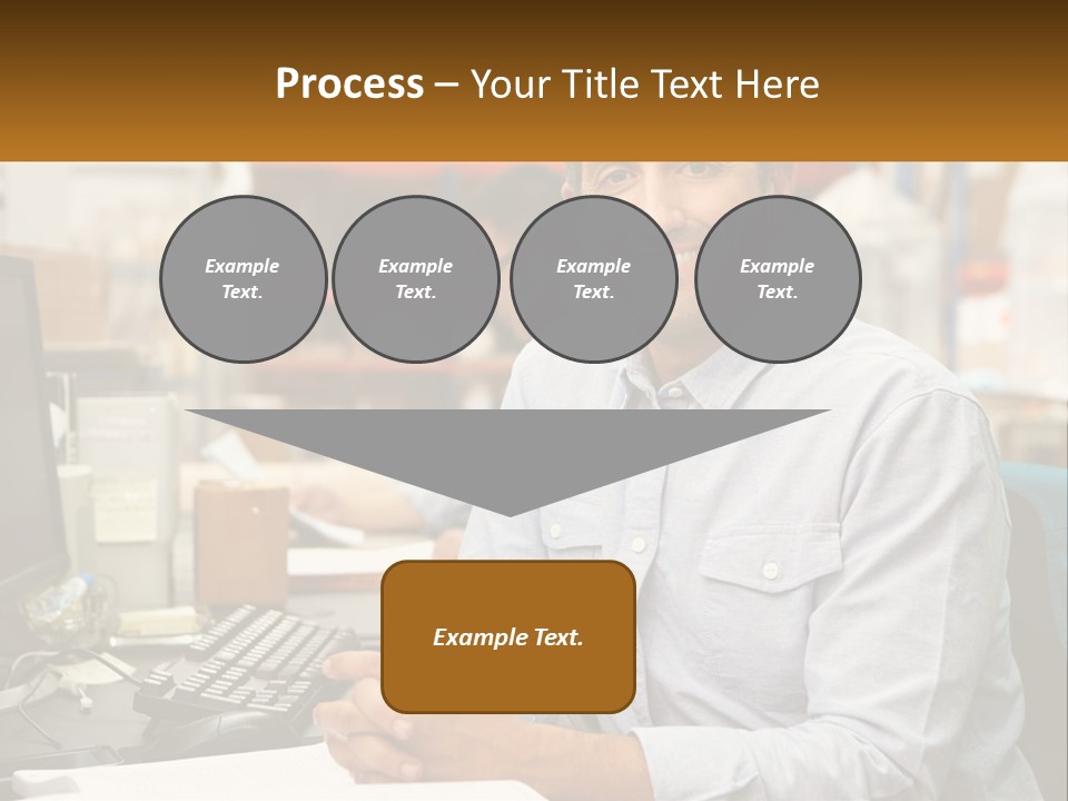 A Man Sitting At A Desk In Front Of A Computer PowerPoint Template