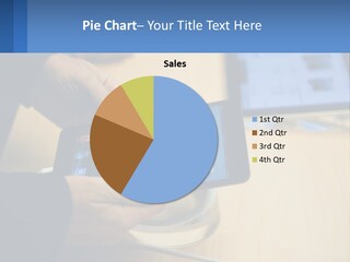 A Person Holding A Tablet On A Table PowerPoint Template
