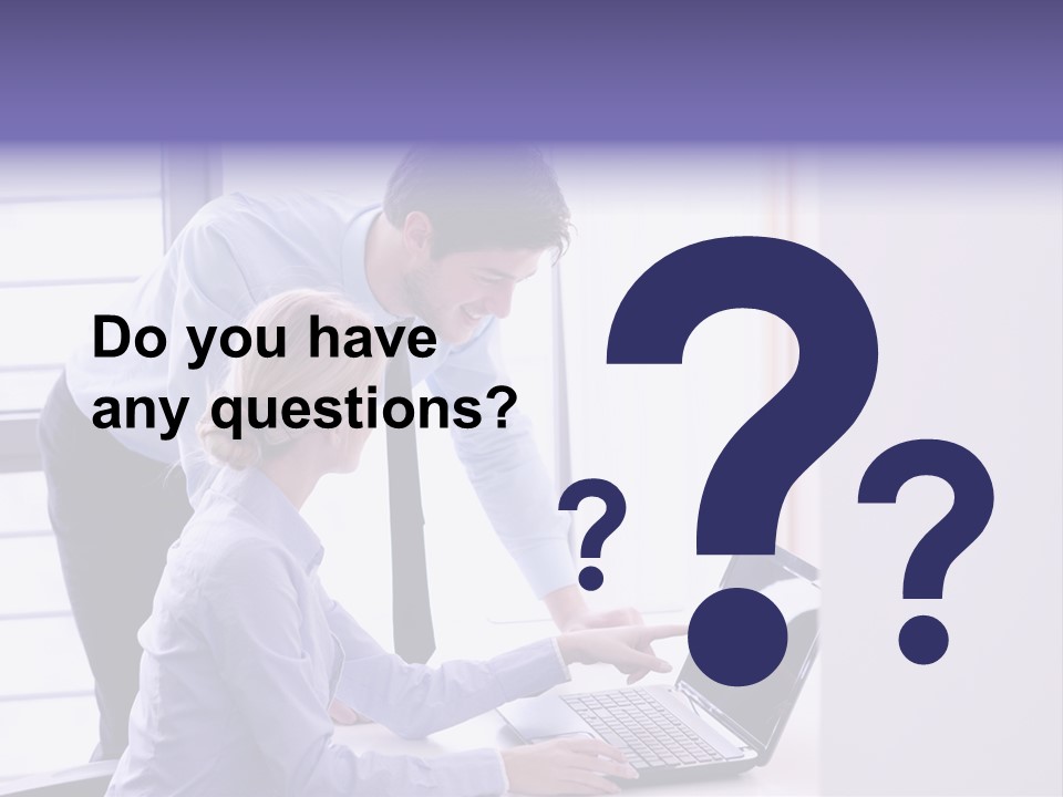A Man And A Woman Looking At A Laptop PowerPoint Template