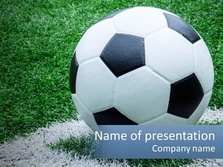 A Soccer Ball Sitting On Top Of A Lush Green Field PowerPoint Template