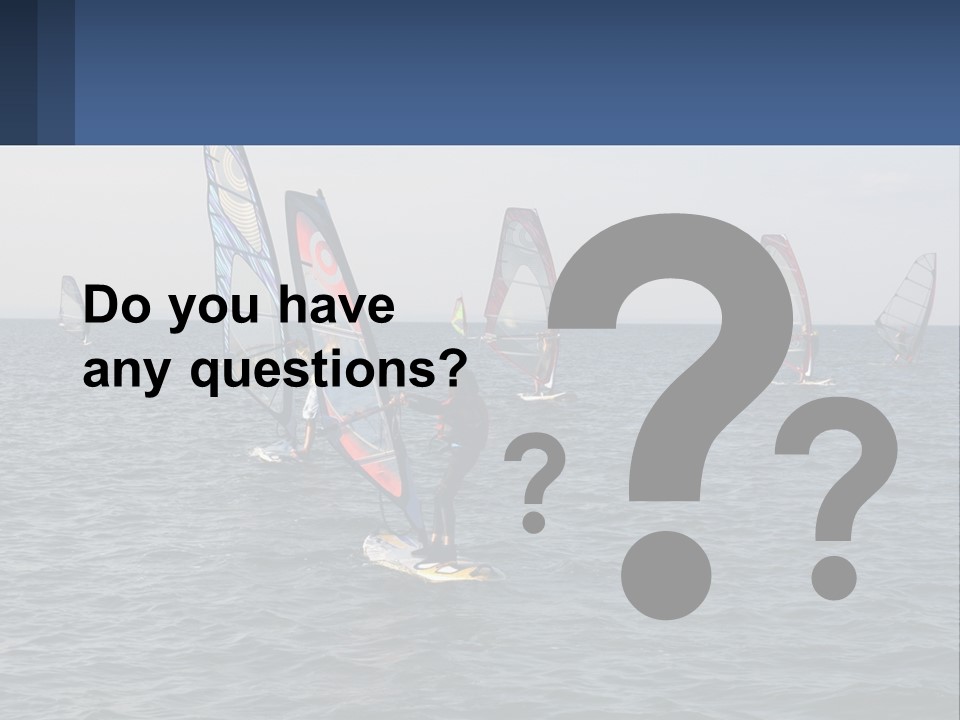 A Woman Windsurfing In The Ocean With Other Sailboats In The Background PowerPoint Template
