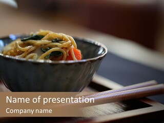 A Bowl Of Noodles With Carrots And Spinach In It PowerPoint Template