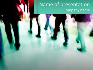 A Group Of People Walking Down A Street PowerPoint Template