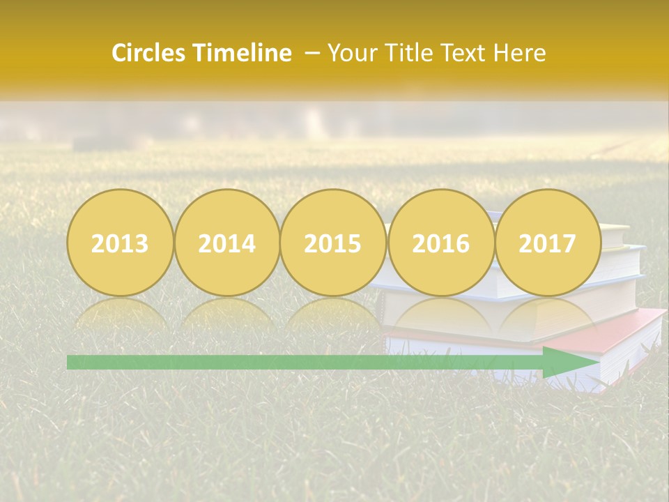 A Stack Of Books Sitting On Top Of A Lush Green Field PowerPoint Template